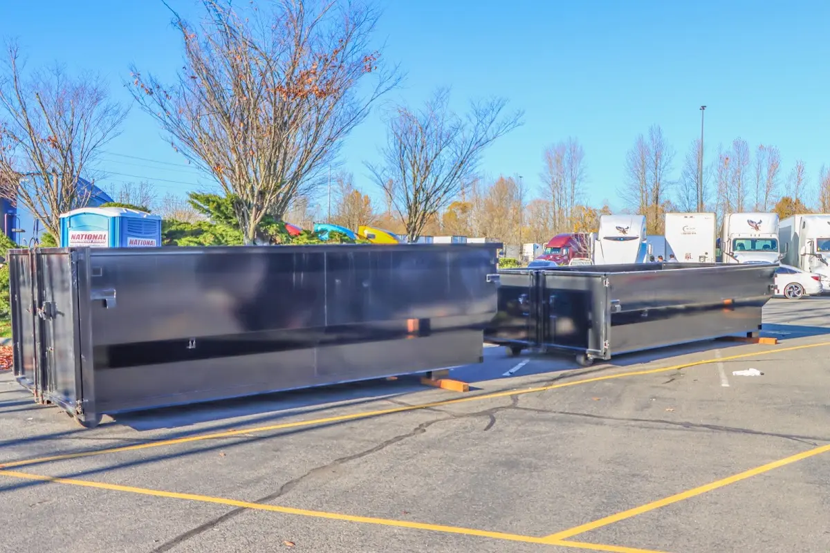 Professional dumpster rental service with roll-off container on residential driveway in Gaffney